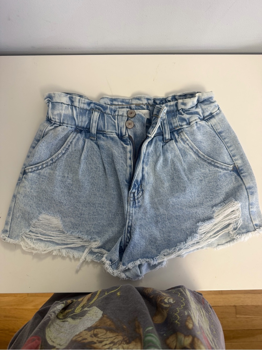 High-Rise Light Blue Paperbag Denim Shorts with Distressed Hem